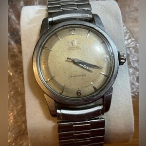 Omega: men’s Seamaster automatic stretchy silver band Speidel USA wrist watch.